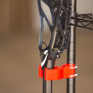 Lacrosse stick wire shelf hook