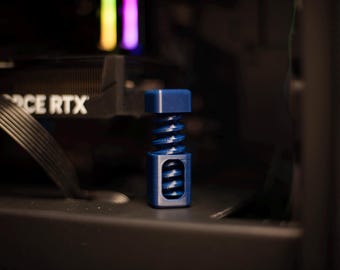 May include: A blue plastic spring-loaded stand for a computer component. The stand is designed to hold a component in place and prevent it from moving around.