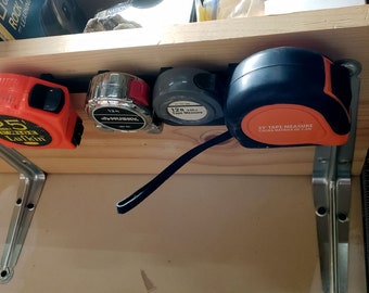Tape measure hanger - 5 positions (under shelf or wall)