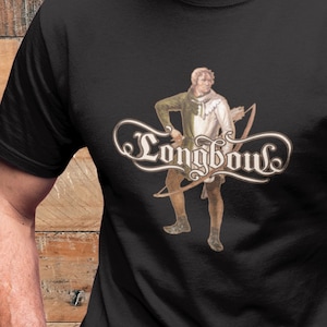 May include: Black t-shirt featuring a vintage illustration of an archer with a bow and arrow. The design includes the word "Longbow" in an ornate script. The archer is dressed in period clothing.