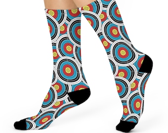 May include: A pair of white socks with a colorful archery target pattern. The socks are black at the toe and heel.