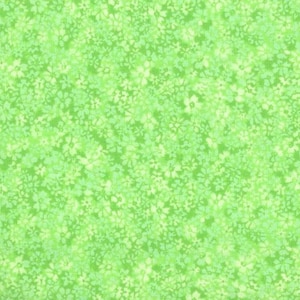 May include: Green fabric with a white floral pattern. The fabric is a light green color with a white floral pattern that is scattered throughout the fabric. The fabric is shown with a measuring tape that shows the fabric is 8 inches wide.