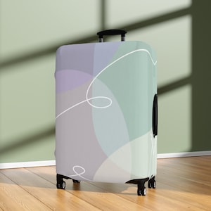 Elegante e minimalista coprivaligia color pastello - Le migliori coperture protettive per valigie e bagagli - Materiale lavabile ed elastico - Regali da viaggio