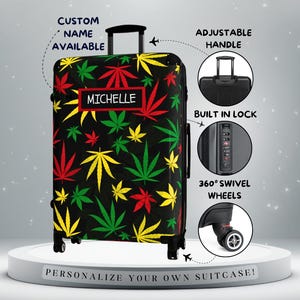 May include: Black suitcase with a colorful cannabis leaf pattern in red, yellow, and green. Features include an adjustable handle, built-in lock, and 360° swivel wheels. The name "MICHELLE" is displayed on a red rectangle. The text "CUSTOM NAME AVAILABLE" is also visible.