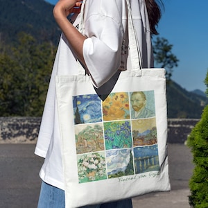 May include: A white canvas tote bag with a collage of nine famous Vincent van Gogh paintings. The paintings include Starry Night, Sunflowers, Self-Portrait, The Olive Trees, Irises, Wheatfield with Crows, Almond Blossom, and The Starry Night Over the Rhone. The bag has the artist's name, "Vincent van Gogh", printed in green at the bottom.