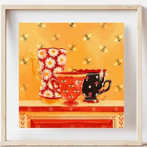May include: Three ceramic cups with a bee motif on a yellow background with a bee pattern. The cups are red, black, and white with floral designs. The cups are on a red and white shelf with a floral design.