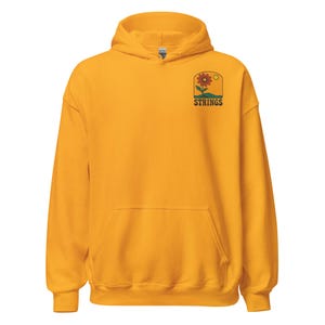 May include: Mustard yellow hoodie with a front pocket and a drawstring hood. The upper right chest features a floral design with the word "STRINGS" in a retro font. The hoodie is made of a soft, comfortable material.