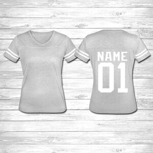 May include: Gray jersey with white stripes on the sleeves and a white number "01" and the word "NAME" on the back.