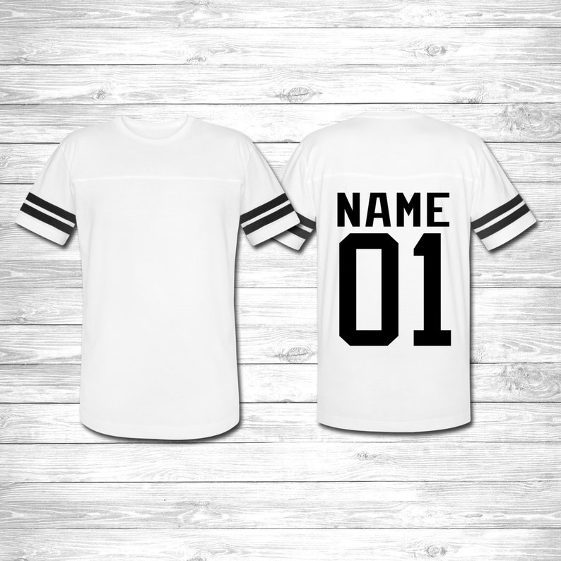 May include: White jersey with black stripes on the sleeves. The back of the jersey has the text "NAME 01" in black.