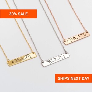 May include: Gold, silver, and rose gold bar necklaces with state outlines and heart designs. Each necklace has a chain and a rectangular pendant with a state map and a heart symbol. The image includes the text "30% SALE".
