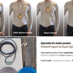 May include: Adjustable disc holder pendant with a black cord. The pendant can be adjusted to different positions on the body, from the sacral chakra to the thymus. The cord is 135 cm long.