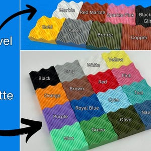 May include: A collection of colorful, textured, wavy blocks in various shades, including gold, silver, and black glitter. The image features the words "novel" and "matte" with arrows pointing to the blocks. The blocks are arranged in rows, showcasing a range of colors.