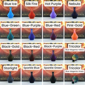 May include: A selection of decorative vases in a range of colours, such as blue, red, purple, and gold. Each vase features a distinctive, swirling pattern. The background text includes "Blue Ice", "Silk Fire", "Hot Purple", and other colour names.
