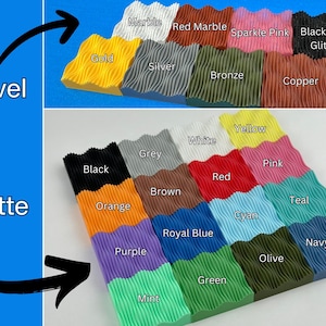 May include: A display of textured blocks in a variety of colours, including gold, silver, and black glitter. The image shows a range of finishes, from matte to novel, with labels such as "Red Marble" and "Royal Blue".