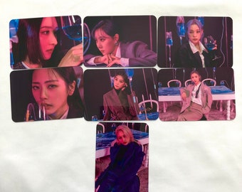 May include: Set of seven photo cards featuring a group of women in various poses. The women are wearing stylish outfits and are holding glasses of wine. The cards have a dark background with a purple and blue color scheme.