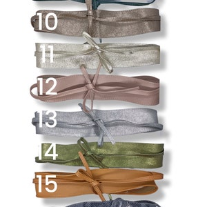 Longue chemise en jacquard extensible aux motifs à carreaux et aux couleurs poudrées. Avec son
