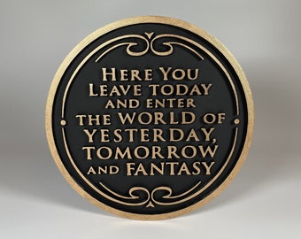 May include: A black and gold round plaque with the text "Here you leave today and enter the world of yesterday, tomorrow, and fantasy".