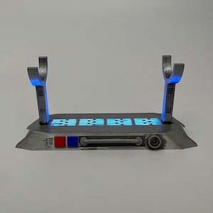 Light up Star Wars lightsaber display stand with blue lighting
