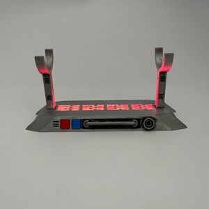 Light up Star Wars lightsaber display stand with red LED lighting