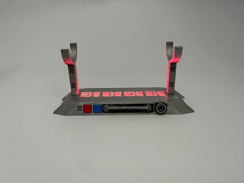 Light up Star Wars lightsaber display stand with red LED lighting