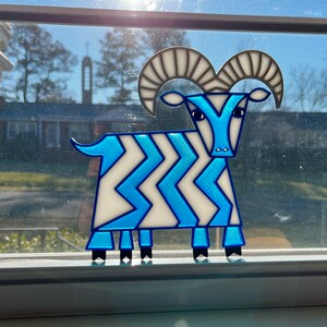 Suncatcher of the Mary Blair five legged goat from Contemporary Resort at Walt Disney World