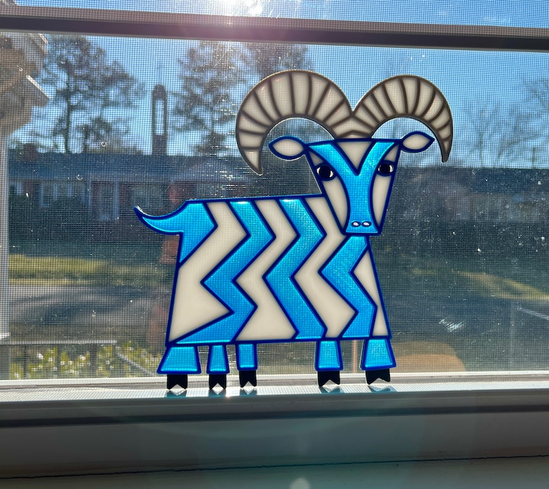 Suncatcher of the Mary Blair five legged goat from Contemporary Resort at Walt Disney World