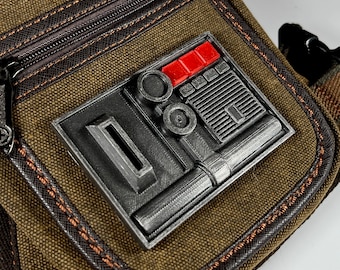 Magnetische op Star Wars geïnspireerde communicatiebadge Comlink Greeblie (versie P)