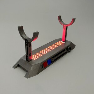 Light up Star Wars lightsaber display stand with red LED lighting