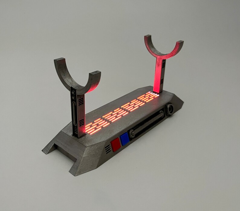 Light up Star Wars lightsaber display stand with red LED lighting