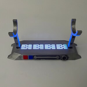 Light up Star Wars lightsaber display stand with blue lighting