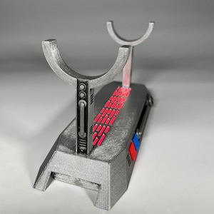 Light up Star Wars lightsaber display stand with red LED lighting