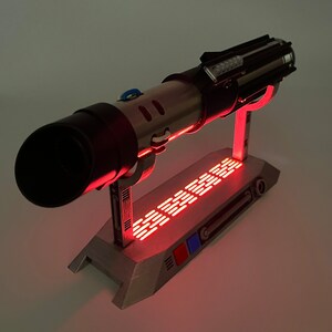 Light up Star Wars lightsaber display stand with red LED lighting