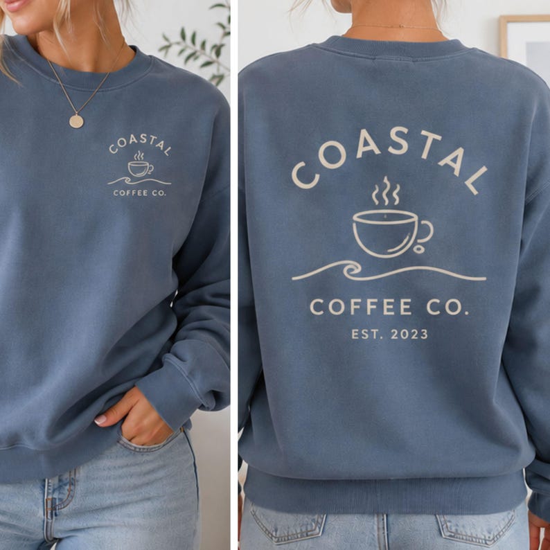 May include: A blue crewneck sweatshirt featuring a small graphic on the front left chest and a large graphic on the back. Both graphics display a coffee cup icon above a wave line with the text Coastal Coffee Co. The back includes Est. 2023.