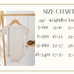 May include: A white baby onesie hangs on a wooden hanger, with a size chart to the right. The chart lists age ranges, weights in pounds, and lengths in inches. The onesie is displayed on a wooden rack.