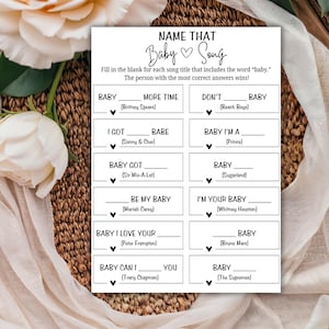 May include: A printable game card with the title "Name That Baby Song". The game requires players to fill in the blank for each song title that includes the word "baby".