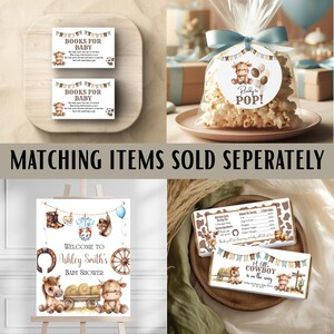 May include: A selection of baby shower decorations with a cowboy theme. Includes signs saying "Books for Baby", a popcorn bag with a "Ready to POP!" tag, and a welcome sign for Ashley Smith's baby shower. Also includes chocolate bar wrappers.
