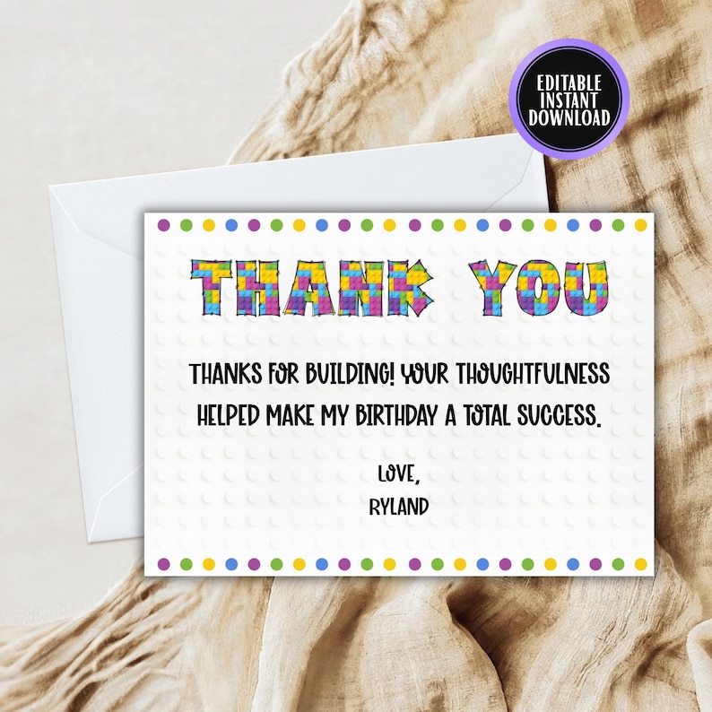 May include: A white thank you card with the words "THANK YOU" in colorful block letters. The card includes the message "THANKS FOR BUILDING! YOUR THOUGHTFULNESS HELPED MAKE MY BIRTHDAY A TOTAL SUCCESS. LOVE, RYLAND."