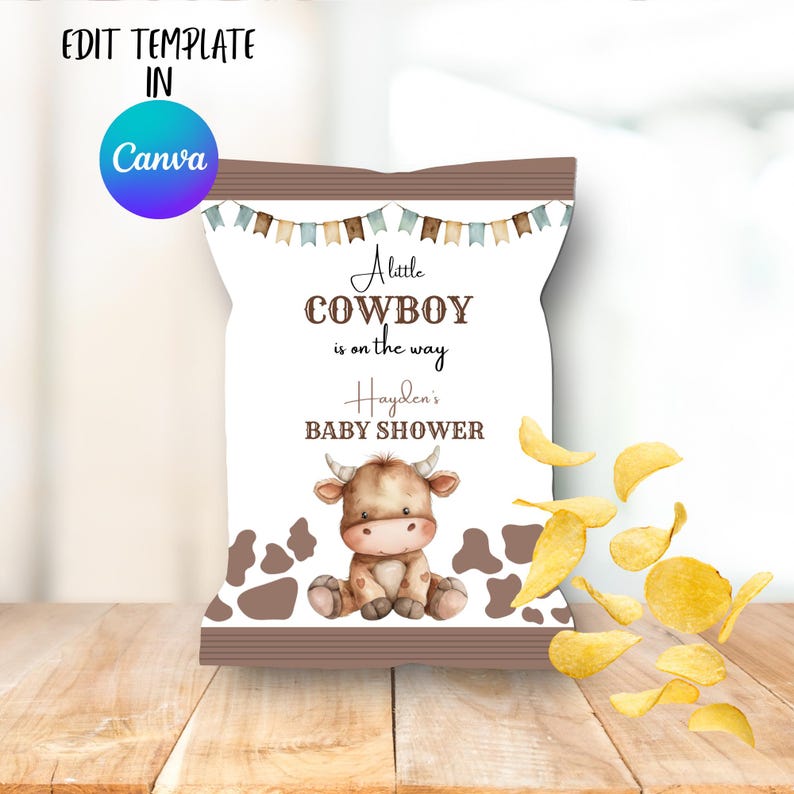 May include: A white chip packet with a brown top and bottom border, featuring a cartoon cow illustration and the text "A little cowboy is on the way" for a baby shower. Potato crisps are scattered around the packet.