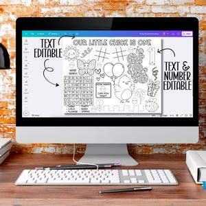 May include: A computer monitor displays a black and white printable activity sheet with the text "OUR LITTLE CHICK IS ONE." The sheet includes a word search, a maze, and illustrations of a chick, balloons, and a bee. The words "TEXT EDITABLE" and "TEXT & NUMBER EDITABLE" are also visible.