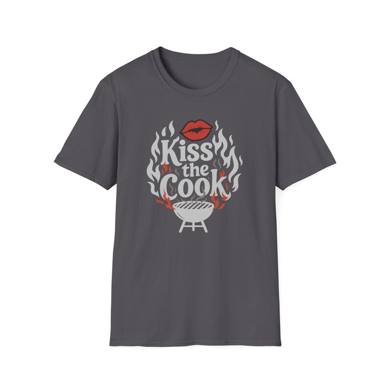 A gray t-shirt with a graphic design featuring a pair of lips and flames surrounding the text "Kiss the Cook".