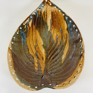 Pottery Basket Base...... Hosta leaf in brown and blue. Designed to be woven with round reed or coiling.