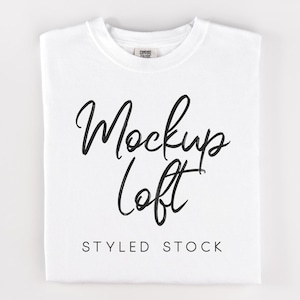 May include: White t-shirt mockup with the text "Mockups Loft" and "Styled Stock" printed on the front.