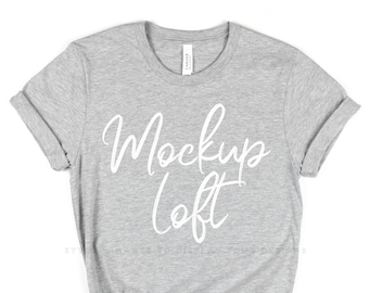 May include: Gray t-shirt with a white "Mockup Loft" text design.