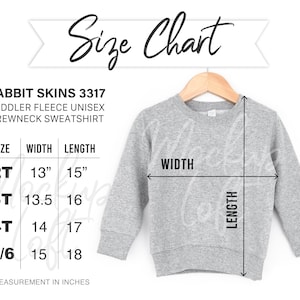 May include: Size chart for a toddler fleece unisex crewneck sweatshirt. The chart shows sizes 2T, 3T, 4T, and 5/6 with corresponding width and length measurements in inches.