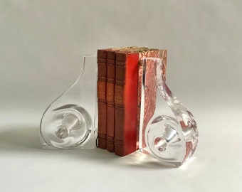 pair of lucite bookends, abstract modern vintage mid century vibe by Ritts Astrolite, curvy shape & pierced hole detail, excellent condition