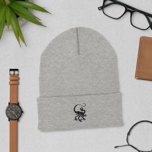 Velociraptor Fossil Beanie – Light Knit Hat with Dark Embroidered Skeleton – Dinosaur Gift for Science Fans & Fossil Hunters