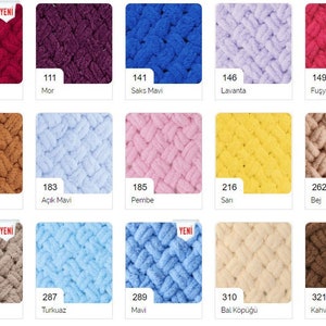 May include: A collection of yarn samples in various colours, including burgundy, purple, blue, lavender, pink, yellow, beige, brown, and grey. The yarn is arranged in a grid pattern and labelled with numbers and names in Turkish.