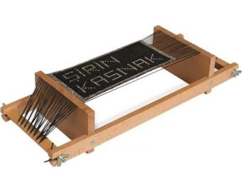 May include: A wooden loom with black string and a woven piece of fabric that says "Start Knitting".