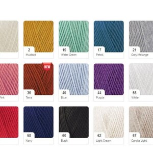 May include: A color chart of yarn samples in various colors, including cream, mustard, water green, petrol, grey melange, candy pink, terra, blue, purple, white, red, navy, black, light cream, and candle light.