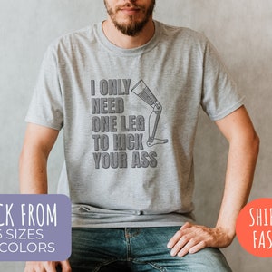 I Only Need One Leg To Kick Your Ass T-Shirt / Funny Leg Amputee Gift for Veteran, Awareness etc. / White + Grey Pre-Shrunk Softstyle Tee